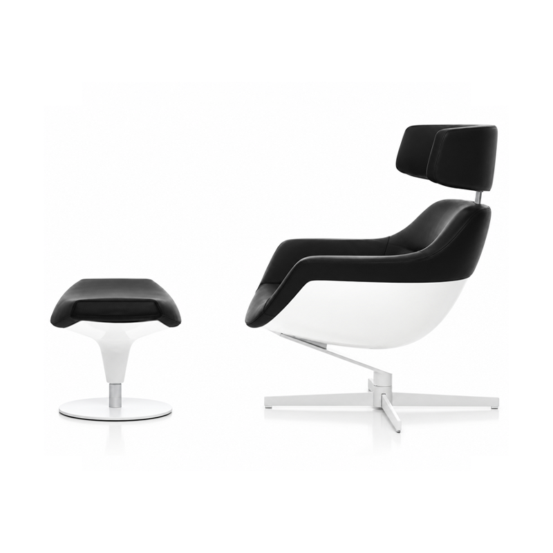 Vue de profil du fauteuil Auckland Cassina noir et blanc avec appuie-tête réglable et repose-pieds assorti