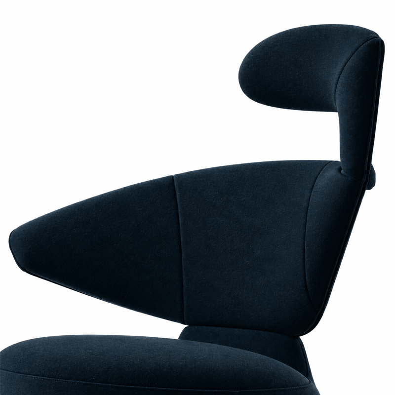 Vue latérale du fauteuil Canta Cassina en tissu bleu foncé avec accoudoir transformable en appuie-tête