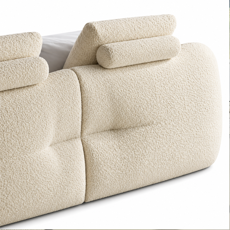 Vue latérale du lit Mon-Nid Cassina montrant son cadre rembourré épais et sa tête de lit arrondie