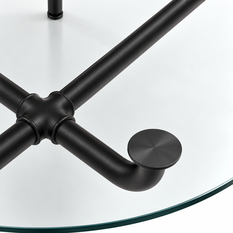 Détail des tubes métalliques noirs et du support du plateau en verre de la table Edison Cassina